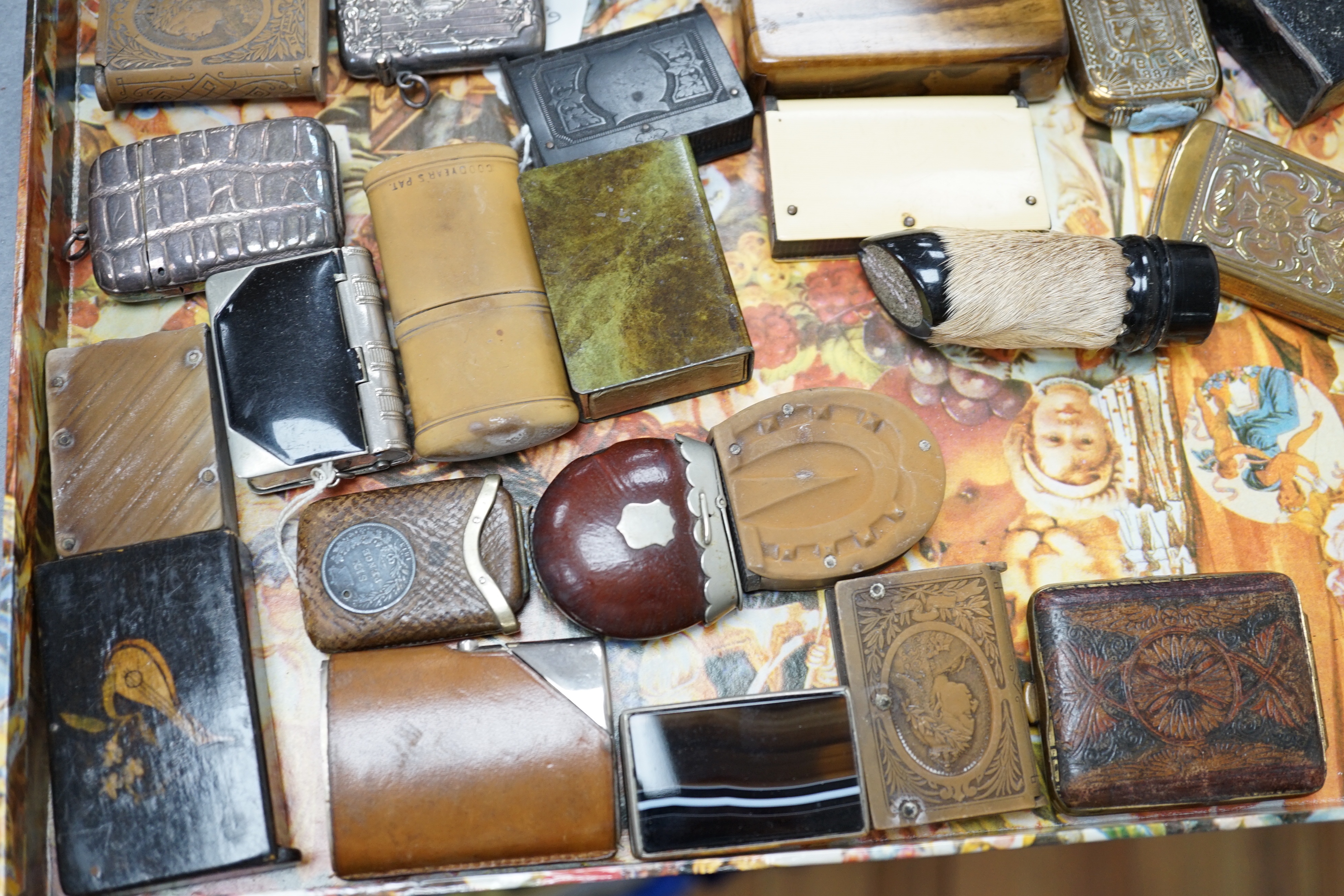 A collection of Victorian and later vestas and matchbox holders, some commemorative